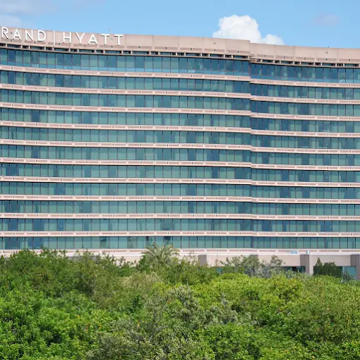 Beachfront hotel tower with solar control window film on guest room glass