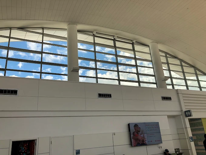 Interior concourse with large clerestory windows treated with solar film
