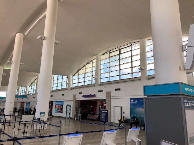 Airport terminal interior with filmed windows controlling glare