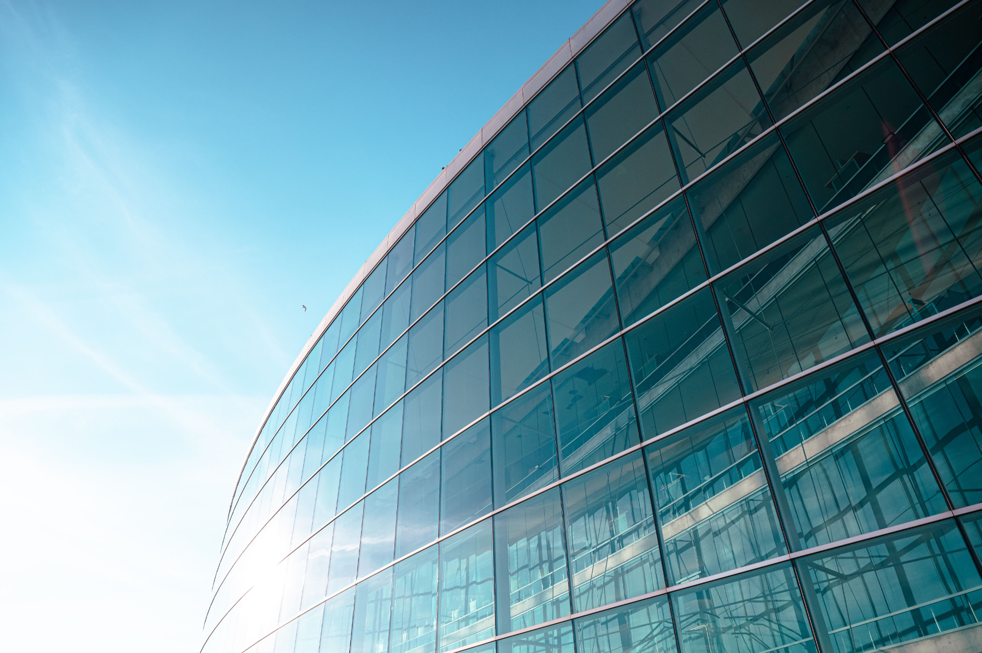 Sunlit commercial glass curtain wall treated with 3M solar control window film